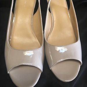 Nine West open toe beige pumps.